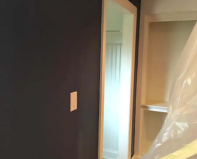 Navy, charcoal, and white millwork — Charcoal wall cut tight to casing