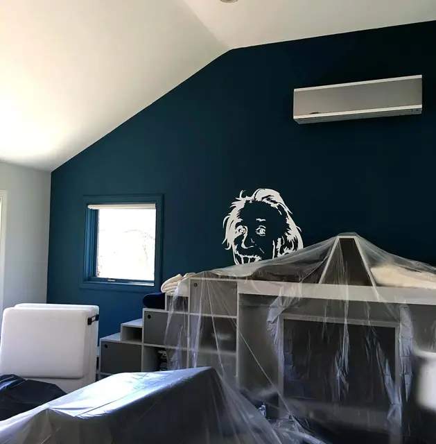 Deep teal under the skylights — Teal gable wall